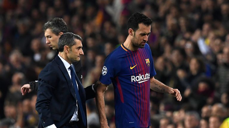 Barcelona's Sergio Busquets limps off with a foot injury during the Champions League last-16 second-leg game against Chelsea