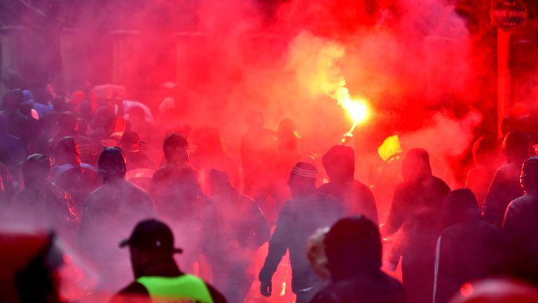 Marseille fans light flares outside the San Mames stadium before the match against Athletic Bilbao
