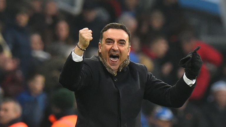 Carlos Carvalhal celebrates Swansea's 0-0 draw with Huddersfield