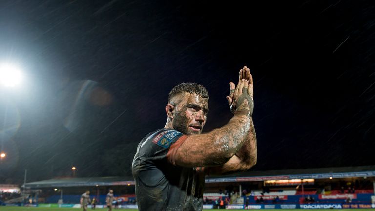 Castleford's mud-covered Mike McMeeken thanks the fans for their support after his side defeated Wakefield.