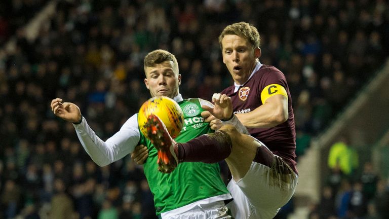 Hibernian's Florian Kamberi (L) in action with Hearts' Christophe Berra.