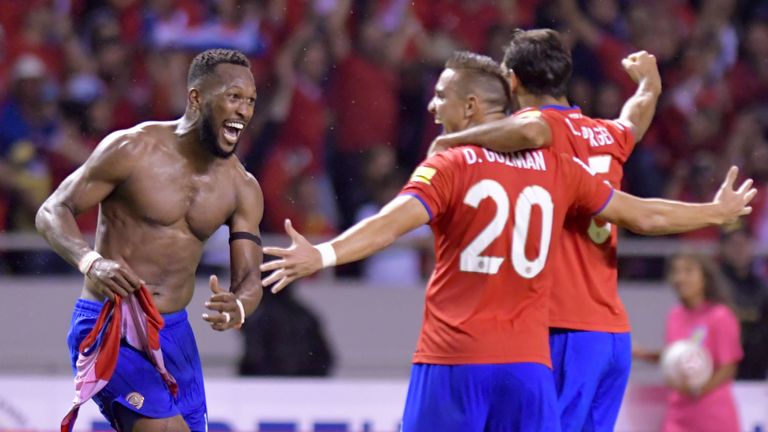 Kendall Waston celebrates with teammates after scoring against Honduras, which secured Costa Rica's spot at the World Cup