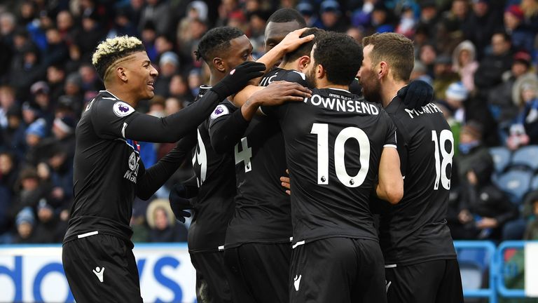 Crystal Palace players celebrate after they defeated Huddersfield 2-0 in the Premier League.