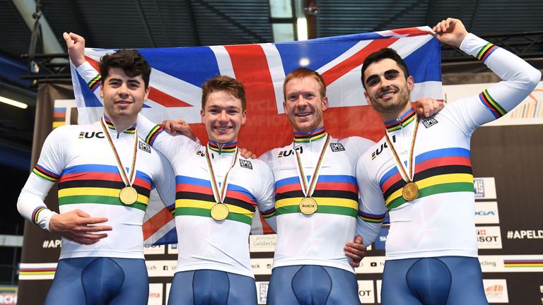  Charlie Tanfield, Ethan Hayter, Edward Clancy and Kian Emadi pose on the podium after winning the men's Team Pursuit during the UCI Track Cycling World Championships