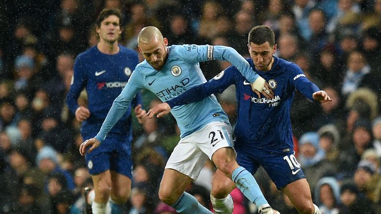 David Silva competes with Eden Hazard in Manchester City's match with Chelsea