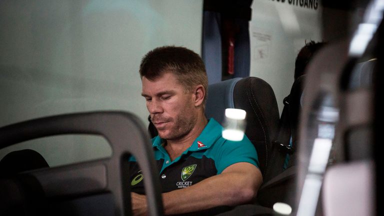 Former Australian vice-captain David Warner sits on the team shuttle bus as the team arrives in Johannesburg