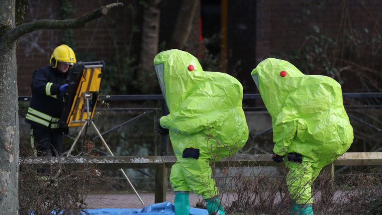Security officers in Hazmat suits after searching a shopping centre in Salisbury