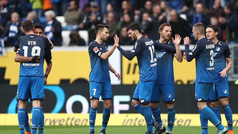 SINSHEIM, GERMANY - MARCH 10: Serge Gnabry of Hoffenheim (left covered) celebrates after he scored a goal to make it 2:0, together with Mark Uth of Hoffenheim, during the Bundesliga match between TSG 1899 Hoffenheim and VfL Wolfsburg at Wirsol Rhein-Neckar-Arena on March 10, 20