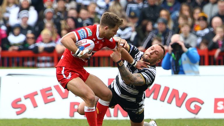 Chris Atkin (L) of Hull KR pushes aside Josh Griffin (R) of Hull FC  in their Good Friday derby encounter