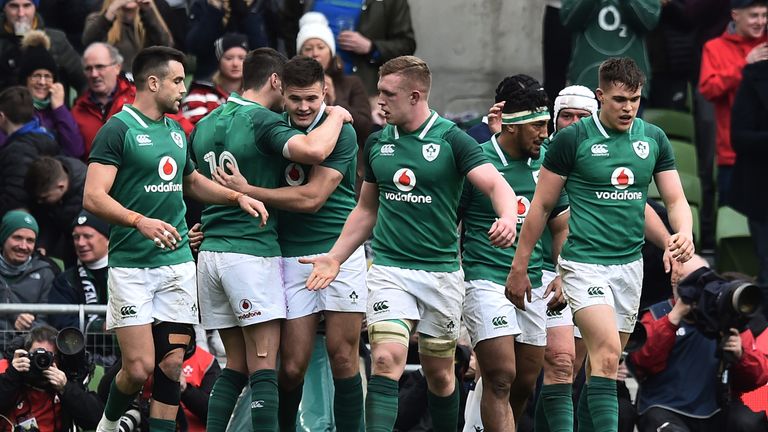 Jacob Stockdale of Ireland celebrates with team mates after his first try against Scotland.