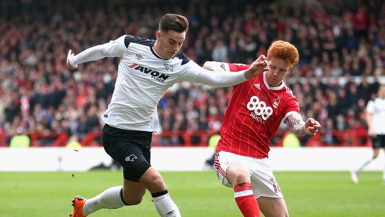 Tom Lawrence (left) and Jack Colback battle for the ball as Nottingham Forest take on Derby