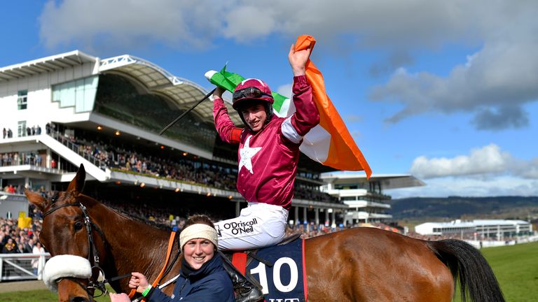 Jack Kennedy riding Shattered Love celebrates victory in the JLT Novices Chase at Cheltenham Festival