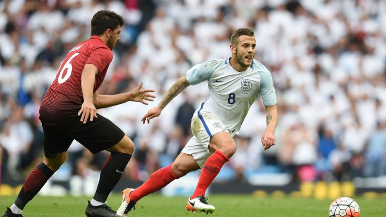 England's Jack Wilshere runs beyond Turkey's Ozan Tufan during the international friendly match at the Etihad Stadium on May 22, 2016