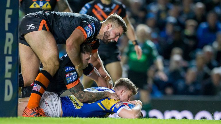 Picture by Allan McKenzie/SWpix.com - 23/03/2018 - Rugby League - Betfred Super League - Leeds Rhinos v Castleford Tigers - Elland Road, Leeds, England - Castleford's Mike McMeeken & Jamie Ellis can't prevent  Leeds's Ash Handley scoring a try.