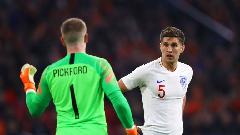 John Stones speaks to Jordan Pickford during the early stages