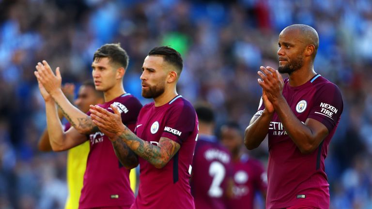 John Stones, Nicolas Otamendi and Vincent Kompany during the Premier League match between Brighton and Hove Albion and Manchester City 