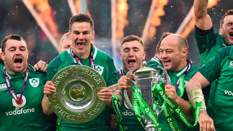 Ireland's Johnny Sexton celebrates with the Triple Crown