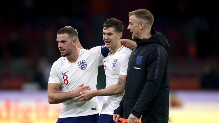 England's Jordan Henderson, John Stones and goalkeeper Joe Hart celebrate after the final whistle during the international friendly match at the Amsterdam ArenA