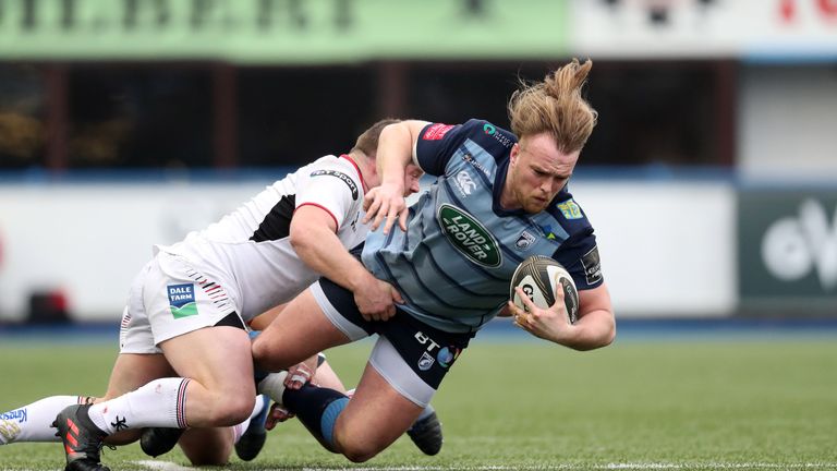 Kristian Dacey breaking through the at attentions of Andrew Warwick 