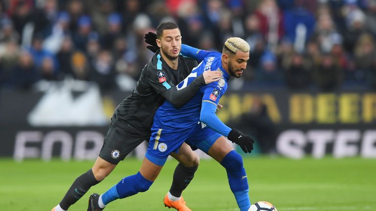 Riyad Mahrez of Leicester City holds off Eden Hazard of Chelsea during The Emirates FA Cup Quarter Final match at The King Power Stadium on March 18, 2018 in Leicester, England