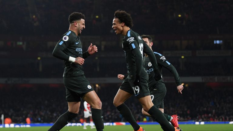 Leroy Sane celebrates with Kyle Walker after extending Manchester City's lead