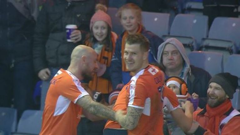 Danny Hylton celebrates his opener during Luton's 2-0 win over Barnet with eight-month old baby Beatrix