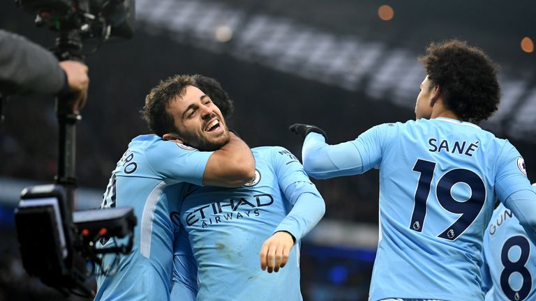Bernardo Silva celebrates his goal with teammates during the Premier League match between Manchester City and Chelsea at the Etihad Stadium on March 4, 2018