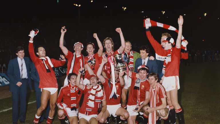 Manchester United celebrate their victory with the trophy after the FA Cup Final replay between Brighton and Hove Albion and Manchester United at Wembley Stadium