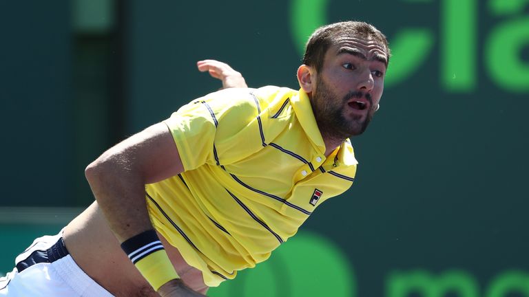 Marin Cilic of Croatia serves against Pierre Hughes Herbert of France during Day 5 of the Miami Open at the Crandon Park Tennis Center on March 23, 2018 in Key Biscayne, Florida