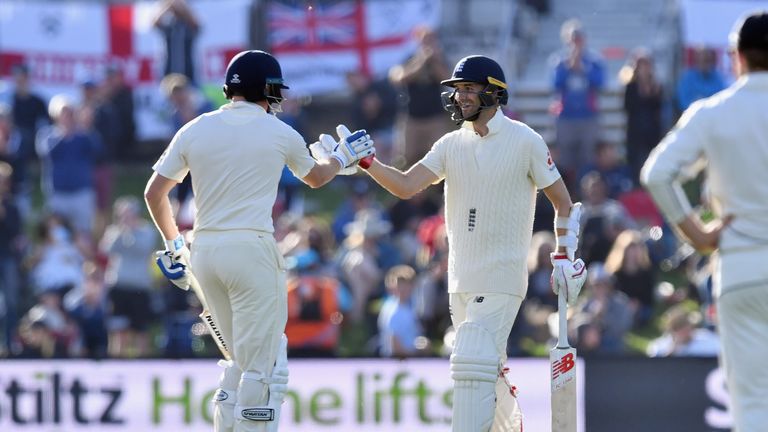 England's Mark Wood (R) is congratulated by Jonny Bairstow after scoring his maiden half century during day one of the Second Test match between New Zealand and England.