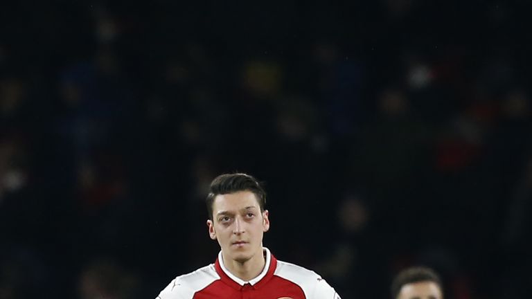 Mesut Ozil cuts a dejected figure during the Premier League match between Arsenal and Manchester City at the Emirates Stadium 