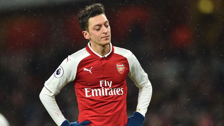 Mesut Ozil cuts a dejected figure during the Premier League match between Arsenal and Manchester City at the Emirates Stadium