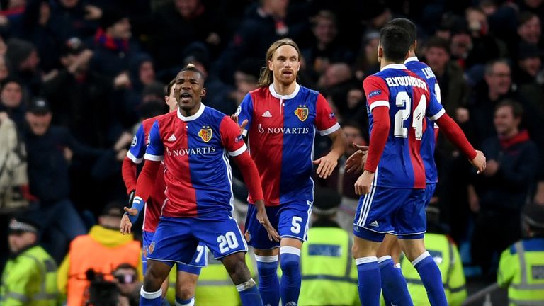 Michael Lang celebrates with Basel team-mates after scoring against Manchester City