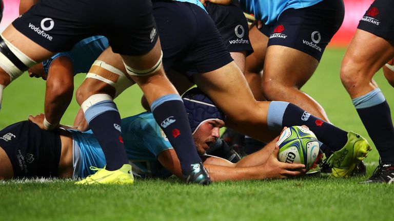 Michael Wells of Waratahs scores a try in round 2