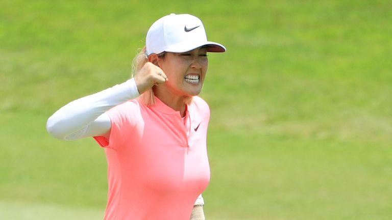 SINGAPORE - MARCH 04:  Michelle Wie of the United States celebrates her birdie on the 18th green on her way to winning during the final round of the HSBC Women's World Championship at Sentosa Golf Club on March 4, 2018 in Singapore.  (Photo by Andrew Redington/Getty Images)