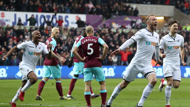 Mike van der Hoorn doubles Swansea's lead at the Liberty Stadium