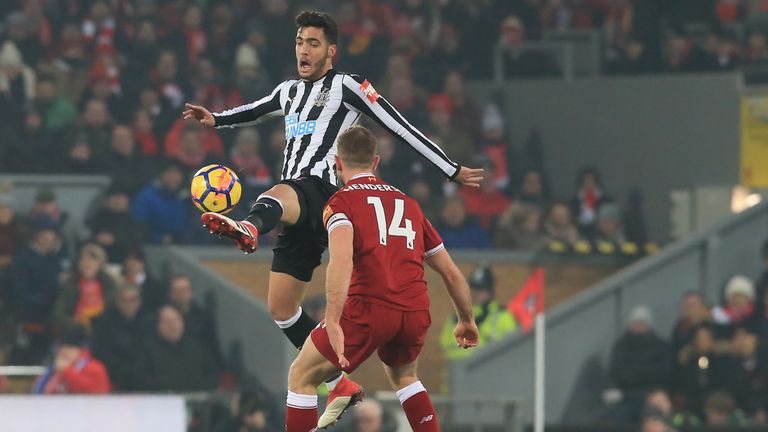 Mikel Merino and Jordan Henderson in action during the Premier league match at Anfield