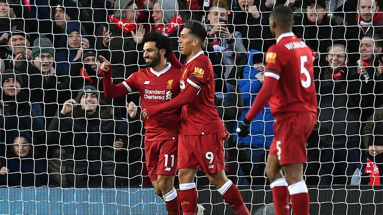 Liverpool's Mohamed Salah celebrates scoring his second goal of the game with Roberto Firmino 