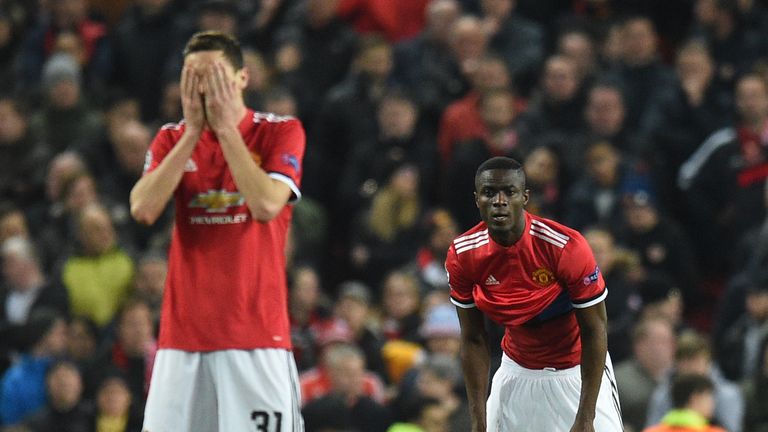 Nemanja Matic (L) and Eric Bailly react after Sevilla scored their second goal against Manchester United