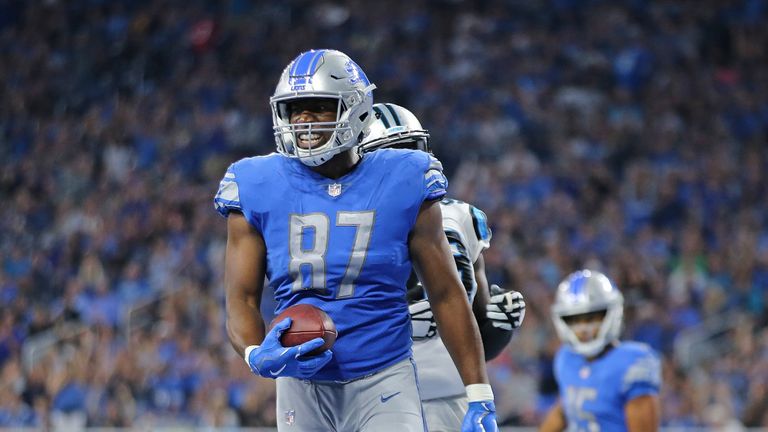 Darren Fells #87 of the Detroit Lions scores a late fourth quarter touchdown during the game against the Carolina Panthers