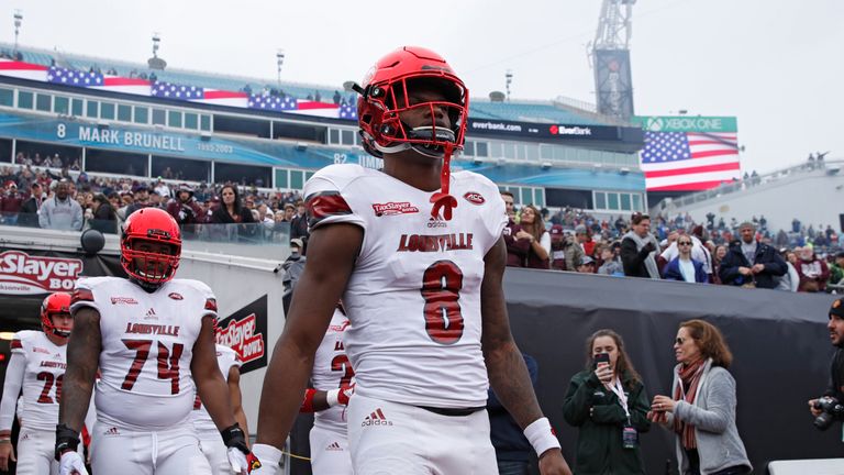 Lamar Jackson walks out for the Louisville Cardinals at the TaxSlayer Bowl on December 30, 2017