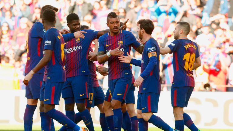 Barcelona players celebrate after Paco Alcacer scored during the Spanish League football match between FC Barcelona and Athletic Club Bilbao at the Camp Nou stadium in Barcelona on March 18, 2018