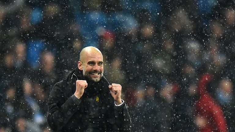 Pep Guardiola celebrates Manchester City's win over Chelsea