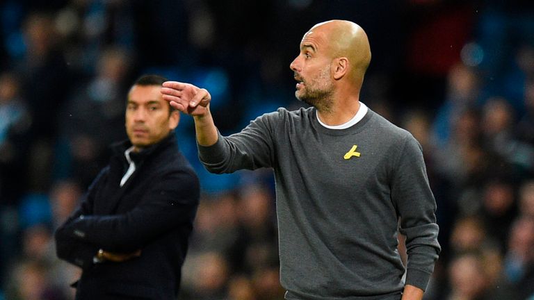 Manchester City manager Pep Guardiola wearing yellow ribbon