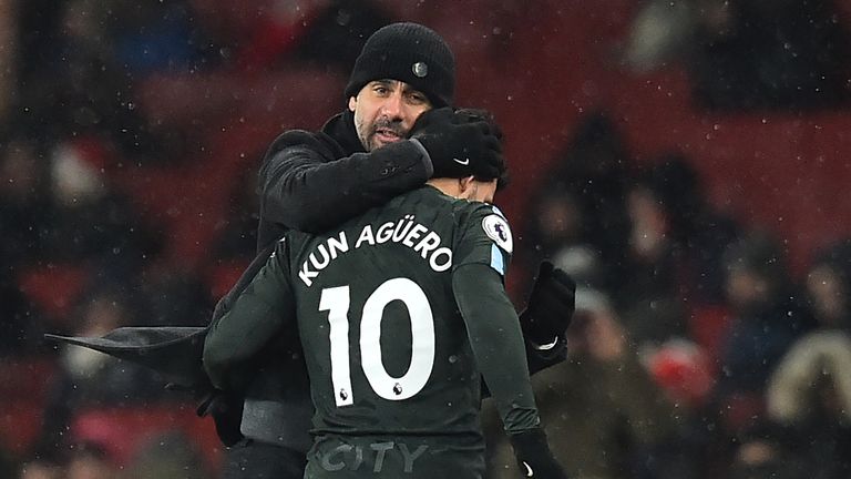 Pep Guardiola embraces Sergio Aguero as he's substituted during the 3-0 Premier League win over Arsenal