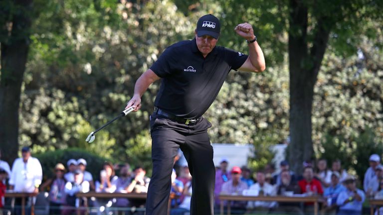 Phil Mickelson celebrates after holing a birdie putt in the final round of the WGC-Mexico Championship