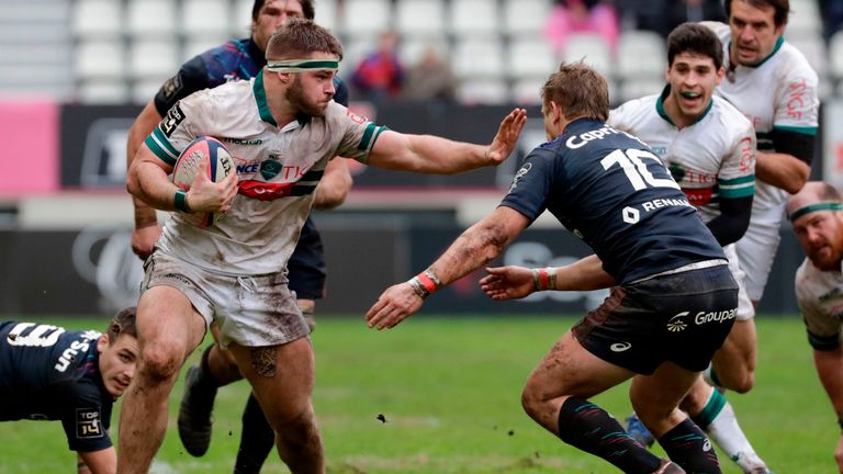 Quentin Lespiaucq of Pau carries the ball forwards in the TOP14