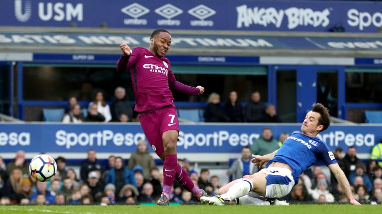 Manchester City's Raheem Sterling (centre) scores his side's third goal of the game during the Premier League match at Goodison Park