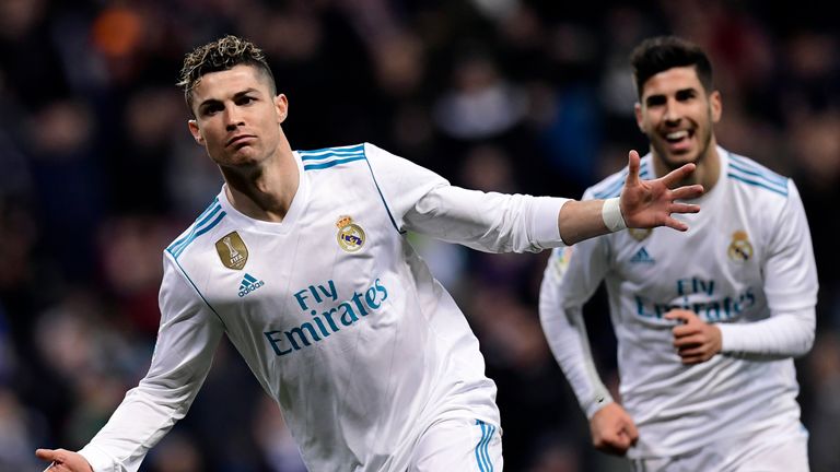 Real Madrid's Portuguese forward Cristiano Ronaldo celebrates a goal during the Spanish League football match between Real Madrid CF and Girona FC at the Santiago Bernabeu stadium in Madrid on March 18, 2018