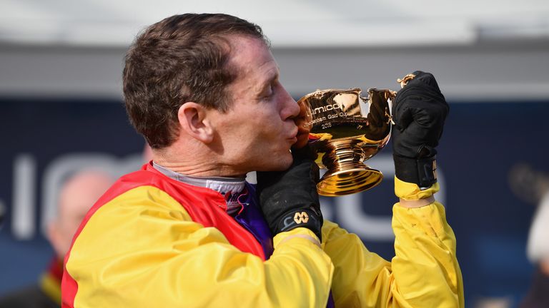 Richard Johnson kisses the Gold Cup after riding Native River to victory in the Timico Cheltenham Gold Cup Chase at the Cheltenham Festival
